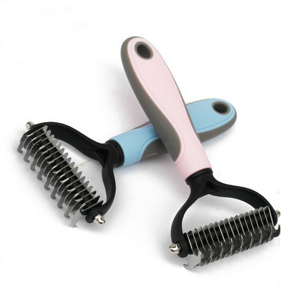 Two Dual-Head Safe Pet Dematting Combs in pink and blue crossed on white background