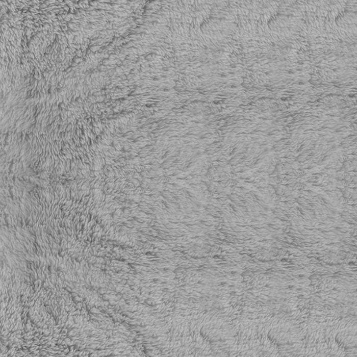 Close-up of soft light grey plush fabric surface of a cat scratching tree