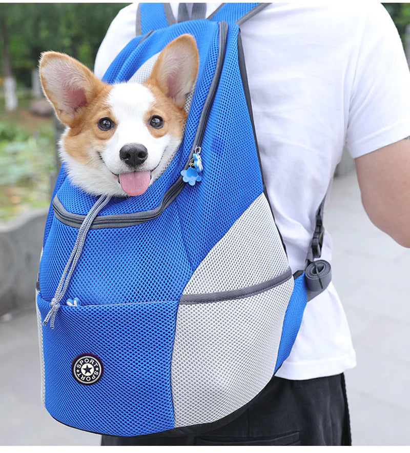 Blue mesh Dog Backpack worn front-facing with smiling Corgi inside