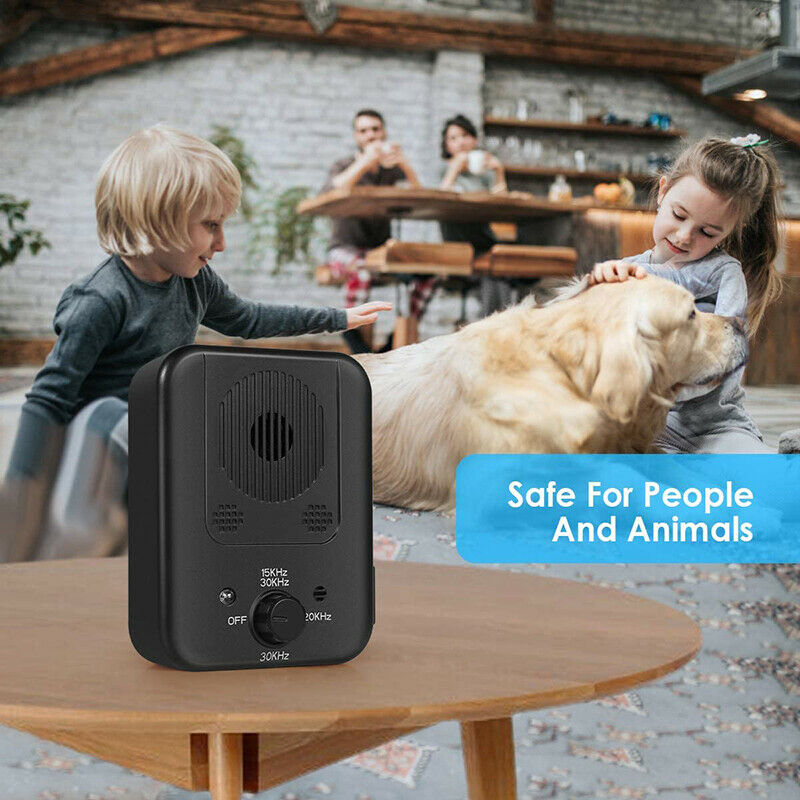 Dog Bark Silencer on table, children and golden retriever in background, safe for people and animals